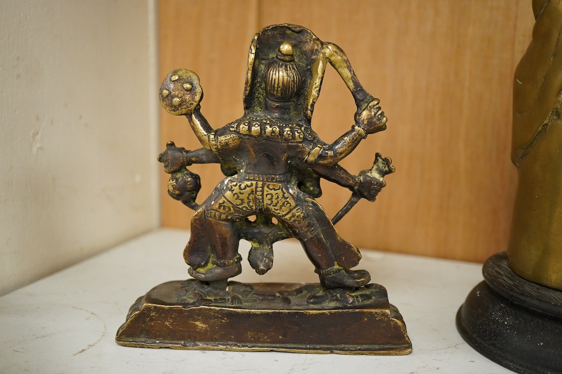 Three South East Asian brass figures to include one of Bodhisattva, largest 28cm high